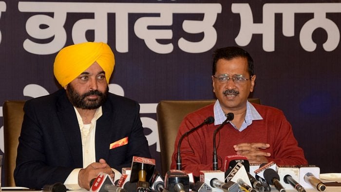 Delhi Chief Minister and AAP convener Arvind Kejriwal with Punjab AAP President and CM Candidate Bhagwant Maan, address a press conference ahead of the Punjab Assembly elections, in Amritsar. Credit: IANS File Photo