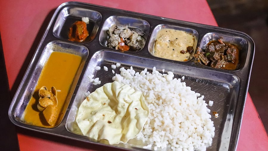 A view of the seafood thali, comprising kokum rasam, dal, three vegetable sides, fish curry and steamed rice. Credit: Deepa Shri Rajan