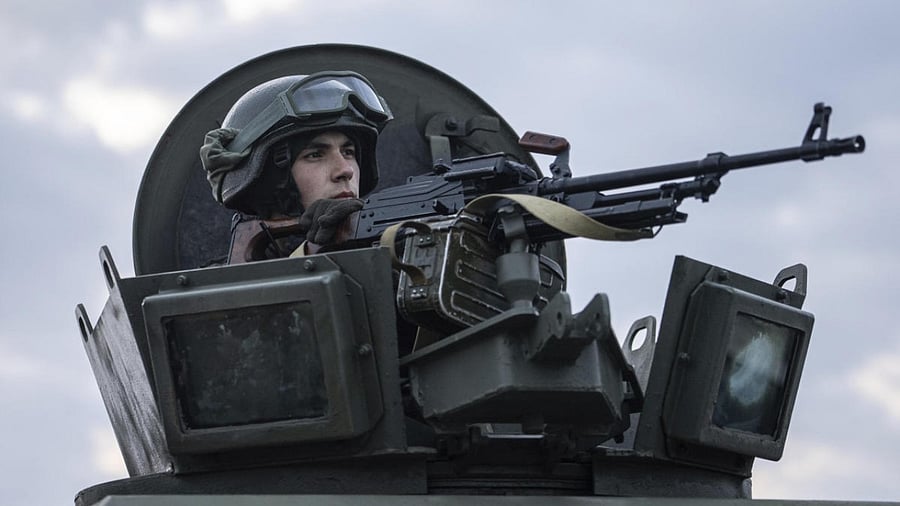 A Ukrainian National guard soldier guards a mobile checkpoint together with the Ukrainian Security Service agents and police officers during a joint operation, in Kharkiv, Ukraine. Credit: AP Photo