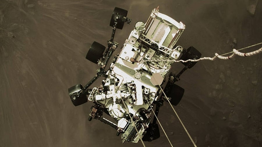 The Mars 2020 descent stage lowers NASAÃ¢Â€Â™s Perseverance rover onto the Red Planet on February 18, 2021. The image is from video captured by a camera aboard the descent stage. Credit: IANS File Photo