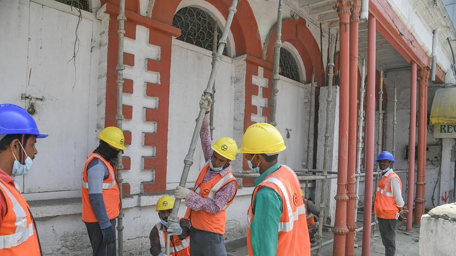 The heritage building that houses the Cauvery Arts and Crafts Emporium on MG Road has been braced with safety scaffoldings. Credit: DH Photo/S K Dinesh