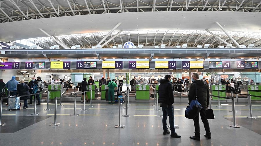 Travellers wait at the check-in counters ahead of their flights at the Boryspil airport some 30 kilometres outside Kyiv. Credit: AFP Photo
