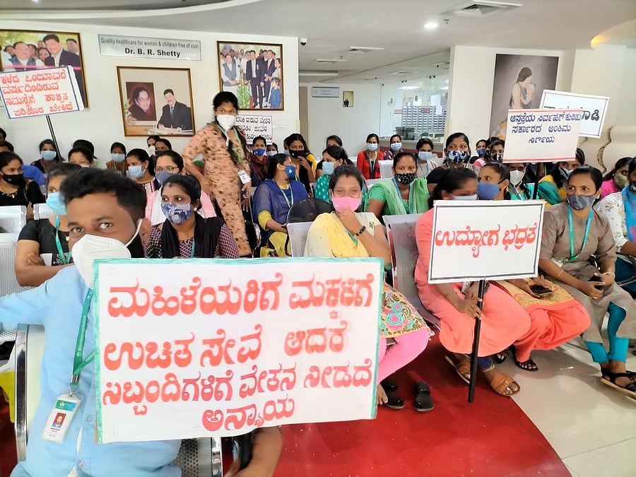 The staff of Koosamma Shambu Shetty Haji Abdullah Memorial Hospital stage a protest in Udupi.