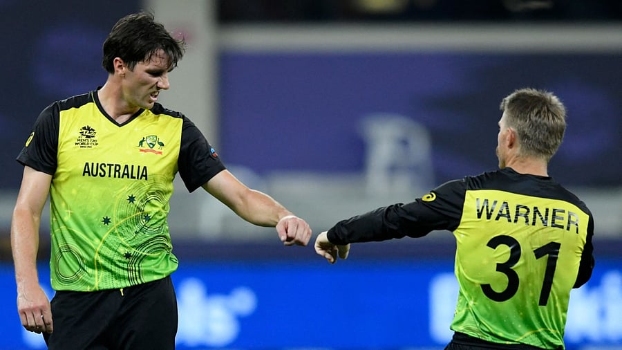 Pat Cummins and David Warner. Credit: AFP Photo