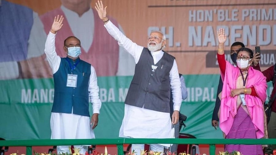 Prime Minister Narendra Modi and Manipur CM N. Biren Singh during a public meeting at Luwangpokpa Multi Sports Complex in Imphal. Credit: IANS Photo