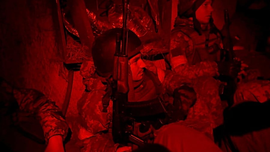 Ukrainian servicemen take cover in a shelter at fighting positions at the military airbase Vasylkiv in the Kyiv region. Credit: Reuters Photo