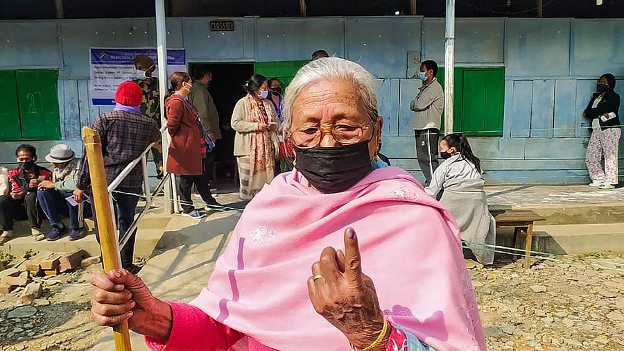 A woman shows her finger marked with indelible ink after casting her vote for the first phase of Manipur Assembly Elections, in Manipur. Credit: PTI Photo