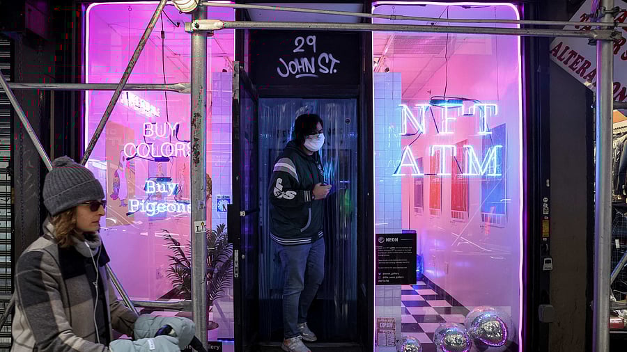 Gaston Charkiewicz, a customer exits a small storefront that hosts digital art collecting platform Neon’s first in-person non-fungible token (NFT) vending machine in Lower Manhattan's financial district of New York City. Credit: Reuters file Photo