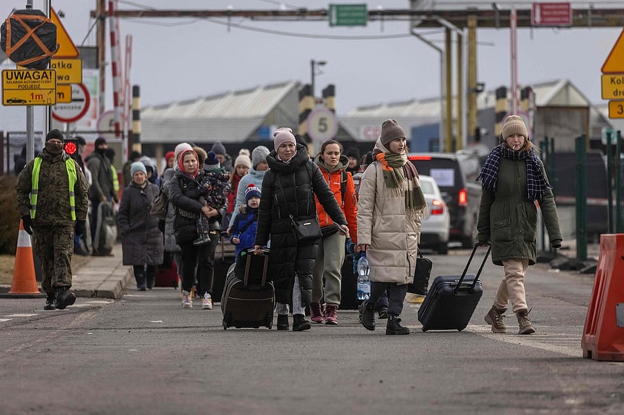 Refugees from Ukraine are pictured after crossing the Ukrainian-Polish border. Credit: AFP Photo