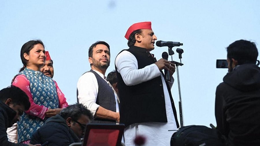 Samajwadi Party (SP) President Akhilesh Yadav speaks as Rashtriya Lok Dal (RLD) President Jayant Chaudhary looks on, during SP-RLD joint rally ahead of the Uttar Pradesh Assembly elections. Credit: PTI Photo