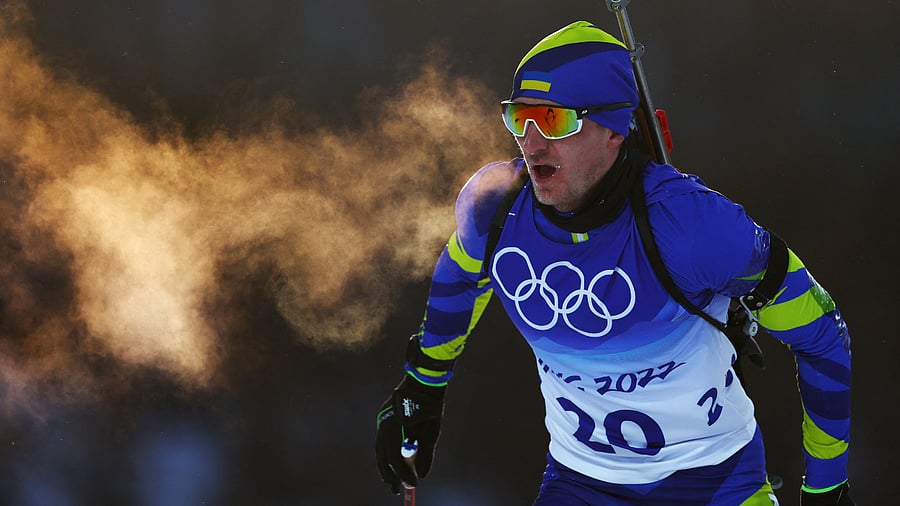 Dmytro Pidruchnyi was competing at the Winter Olympics in Ukraine's national colours. Now he's wearing a military uniform and ballistic helmet. Credit: Reuters Photo