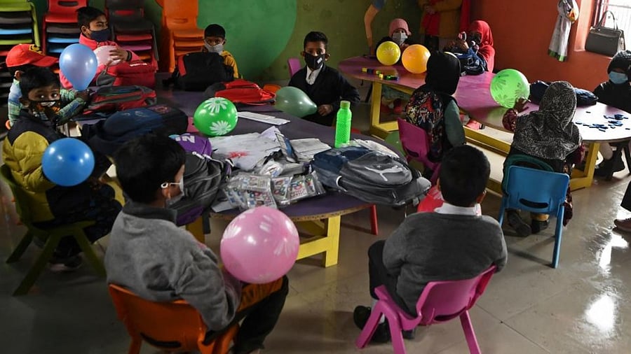 Students attend a class as schools reopened in Srinagar on March 2, 2022. Credit: AFP Photo