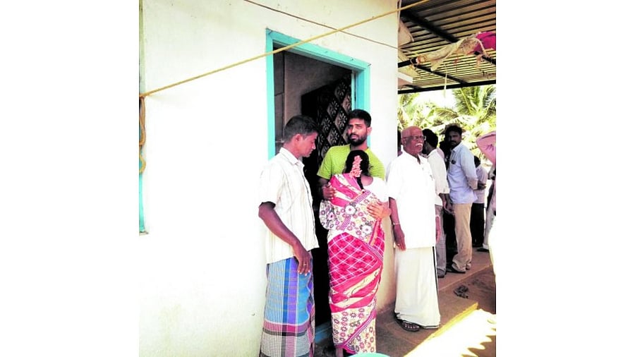 Naveen’s elder brother Harsha is seen receiving visitors, controlling his tears. Credit: DH Photo