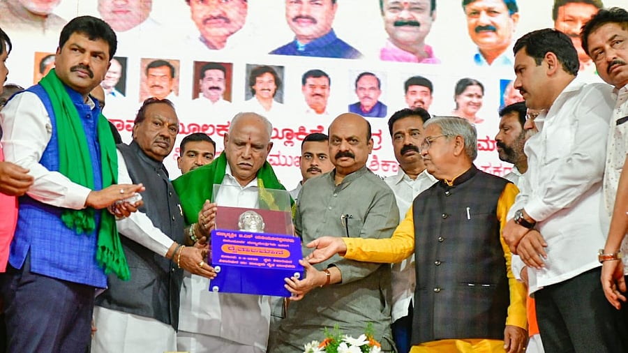 Chief Minister Basavaraj Bommai honours former CM B S Yediyurappa in Shikaripur town on Saturday. Credit: DH Photo