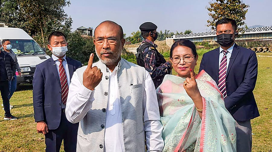 Manipur Chief Minister N. Biren Singh and his wife Hiyainu Devi show their fingers marked with indelible ink after casting their vote for the first phase of Manipur Assembly Elections. Credit: PTI Photo