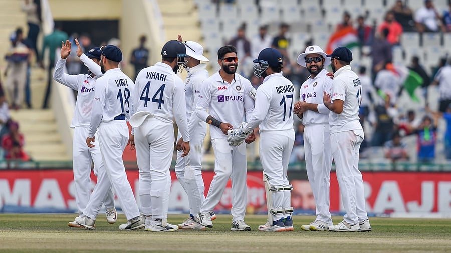 India players celebrate during their first Test triumph over Sri Lanka on Day 3 at Mohali. Credit: PTI Photo
