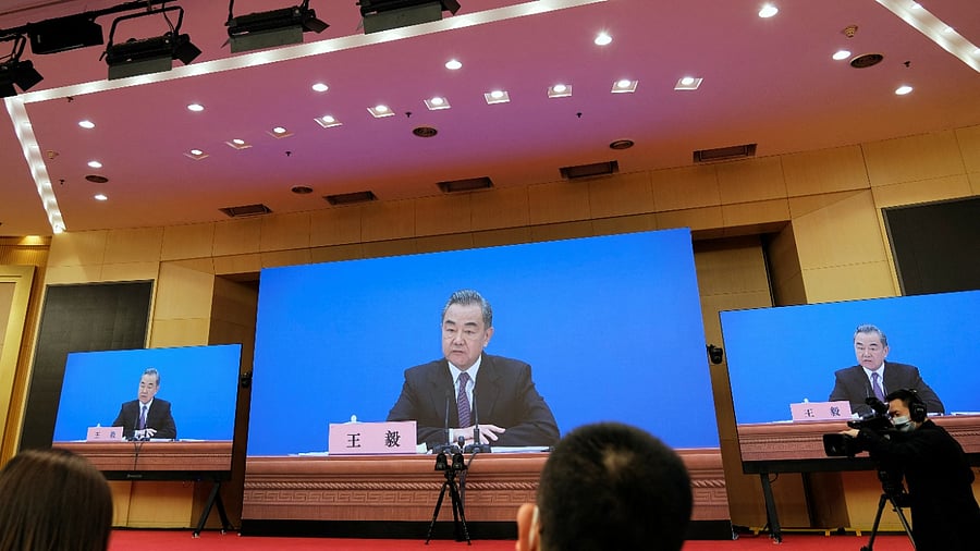 Chinese State Councilor and Foreign Minister Wang Yi attends a news conference via video link in Beijing. Credit: Reuters Photo