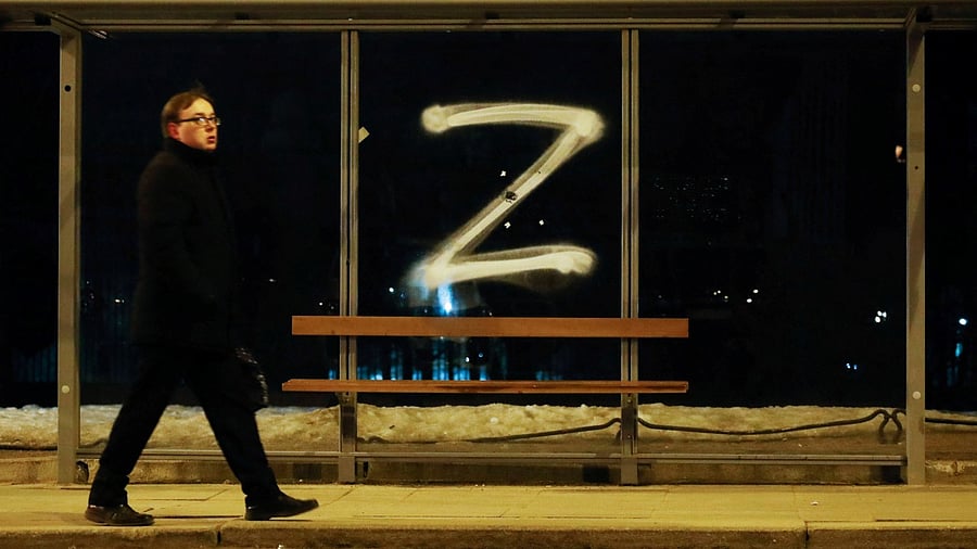  man walks past the symbol "Z" painted on a bus stop in support of the Russian armed forces, as Russia's invasion of Ukraine continues, in Saint Petersburg, Russia March 4, 2022. Credit: Reuters Photo