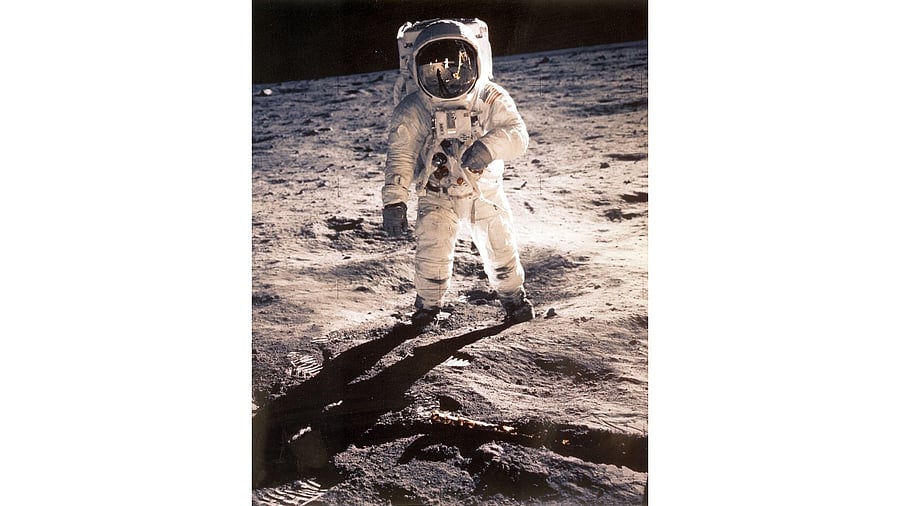 n this file photo taken on July 20, 1969 US Astronaut Edwin "Buzz" Aldrin is shown walking near the Lunar Module during the Apollo 11 space mission. Credit: NASA/AFP