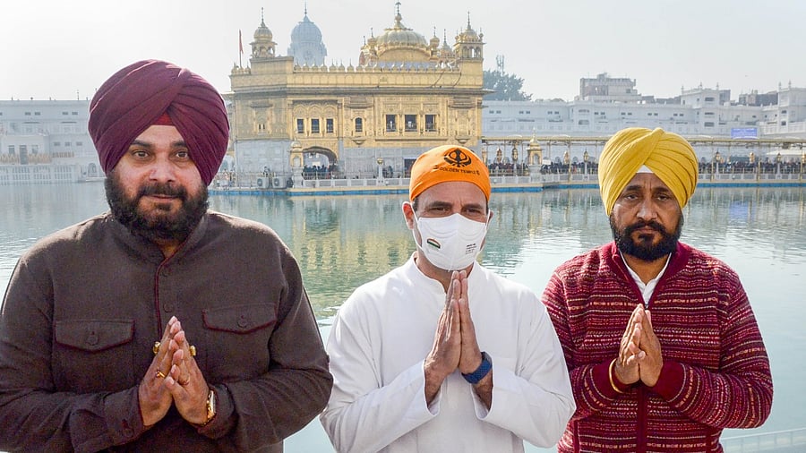 Congress leader Rahul Gandhi with Punjab CM Charanjit Singh Channi and PPCC President Navjot Singh Sidhu at Golden Temple in Amritsar. Credit: PTI File Photo