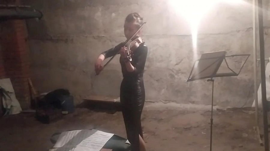 Violinist and teacher Vera Lytovchenko plays her violin in a basement used as bomb shelter amid the Russian invasion of Ukraine, in Kharkiv. Credit: Instagram/@veralytovchenko/Reuters