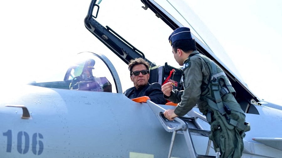 Pakistan PM Imran Khan sits in the cockpit of the Chinese J-10 C combat aircraft as he is briefed during the induction ceremony at the Pakistan Air Force base in Kamra. Credit: Pakistan PMO Photo