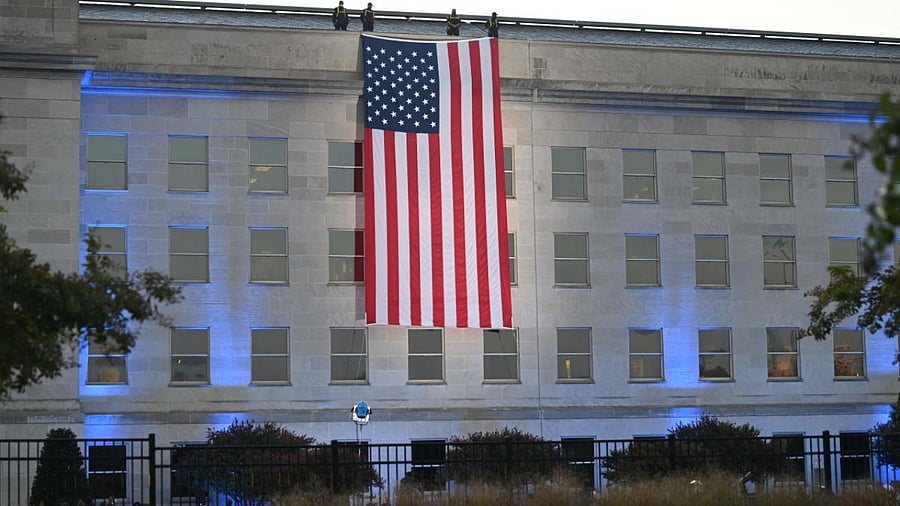 An American flag hangs from the side of the Pentagon to commemorate the 20th anniversary of the 9/11 attacks, on September 11, 2021, in Washington, DC. Credit: AFP Photo