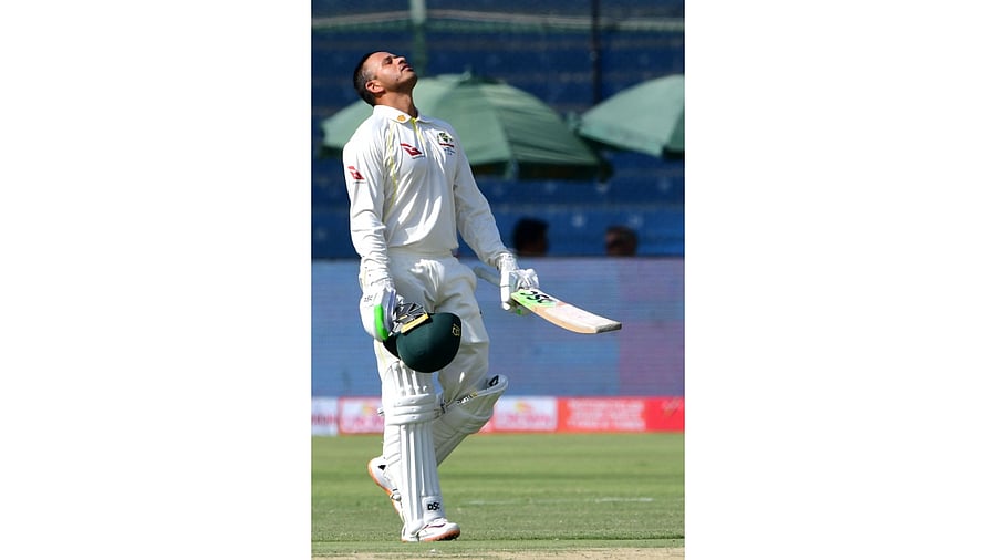 Australia's Usman Khawaja celebrates after scoring a century (100 runs) during the first day of the second Test cricket match between Pakistan and Australia at the National Cricket Stadium in Karachi. Credit: AFP Photo