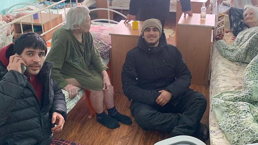 Local resident Teimur Aliev poses as he delivers food and aid to women in care, amid the Russian invasion, in Kharkiv. Credit: Reuters Photo