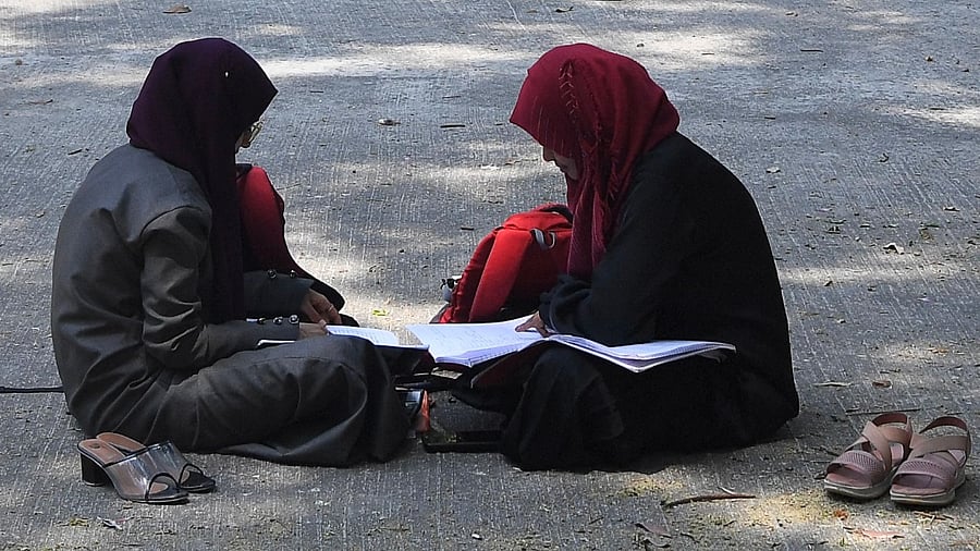 Karnataka HC upheld a local ban on the hijab in classrooms, weeks after the edict stoked violent protests and renewed fears of discrimination against the country's Muslim minority. Credit: AFP Photo