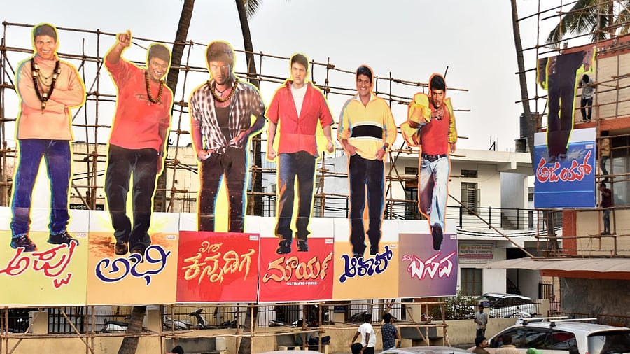 Puneeth’s banners and huge cutouts have come up in most theatres. Credit: DH Photo/Anup Ragh T