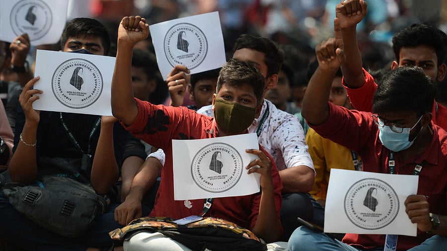 Students hold placards and shout slogans during a demonstration against Karnataka's high court decision to upheld a local ban on the hijab in classrooms. Credit: AFP Photo