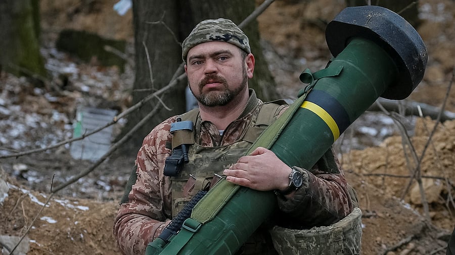 Ukrainian service member holds a Javelin missile system at a position on the front line in the north Kyiv region. Credit: Reuters Photo