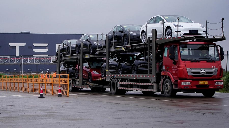 A truck transports new Tesla cars at its factory in Shanghai. Credit: Reuters Photo