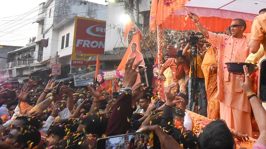 Uttar Pradesh Chief Minister Yogi Adityanath during the 'Holika Dahan Samiti Shobhayatra' on the eve of the festival of 'Holi', in Gorakhpur. Credit: PTI Photo
