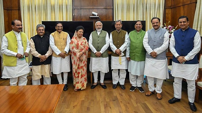 Prime Minister Narendra Modi with BJP MPs from Uttarakhand, Ajay Tamta, Ramesh Pokhriyal, Mala Rajya Laxmi Shah, Tirath Singh Rawat, Naresh Bansal, Ajay Bhatt, and Anil Baluni, and BJP National General Secretary Dushyant Gautam, during their meeting after BJP's victory in recent Uttarakhand Assembly elections, in New Delhi. Credit: PTI Photo