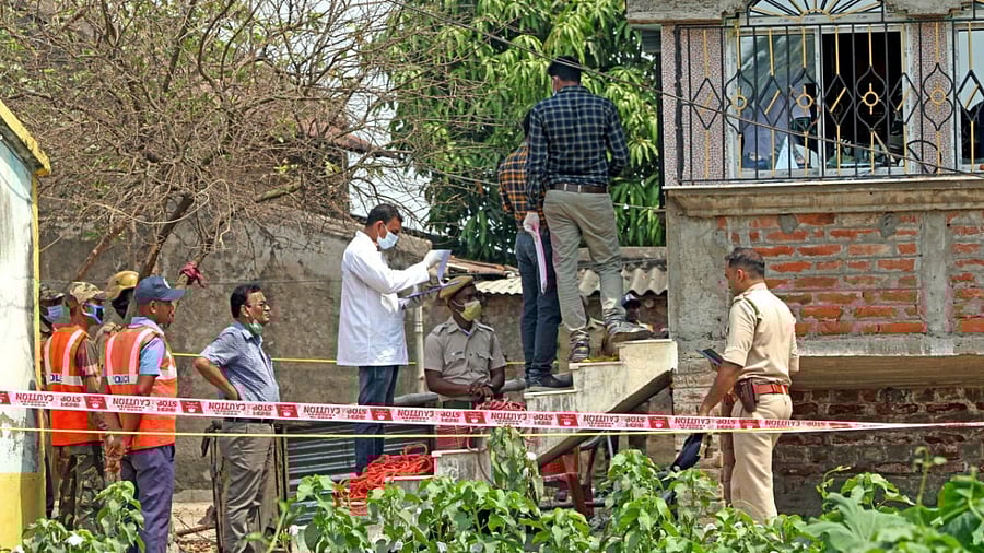 Forensic experts collect samples from the house of Sona Sheikh where seven people were burnt to death keeping captive in their room, allegedly for avenging the killing of TMC leader Bhadu Sheikh, at Rampurhat in Birbhum district. Credit: PTI photo