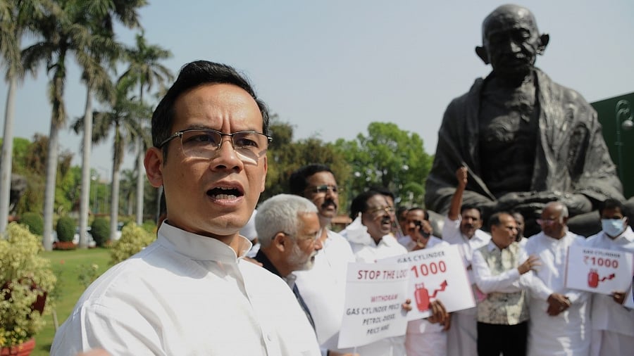 Congress MP Gaurav Gogoi with other MPs protest in front of the Gandhi statue in Parliament, over the increase in the prices of LPG cylinder gas and petrol and diesel. Credit: IANS Photo