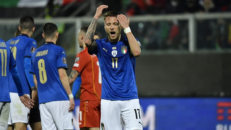Italian players react after losing a crucial qualifying match. Credit: AFP Photo