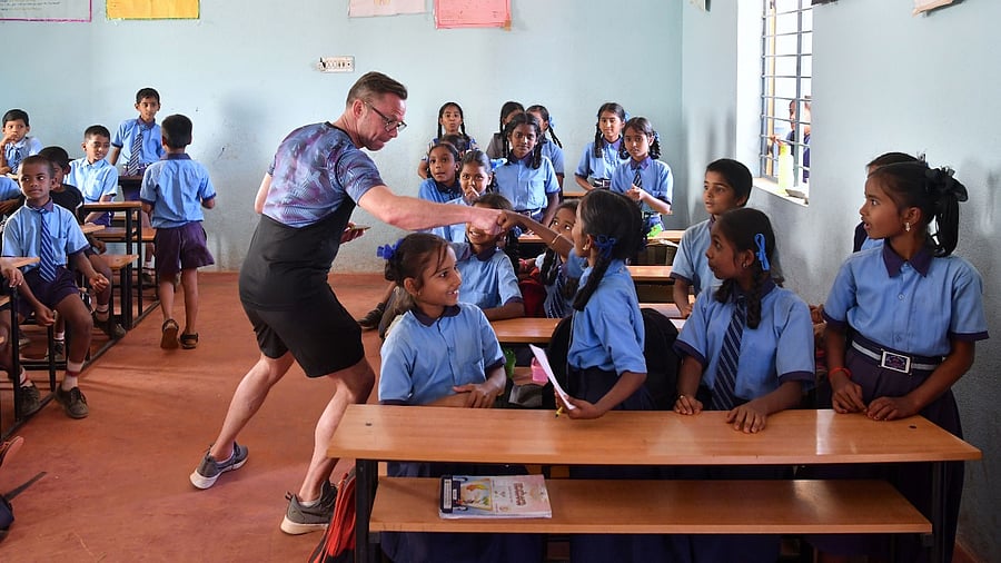Representative image of a sportsperson interacting with students. Credit: iStock Images