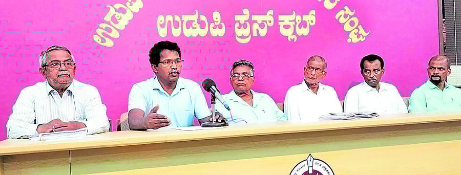 Joint committee of labour organisations convener K Shankar speaks to reporters in Udupi.