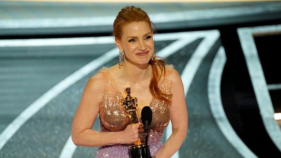 Jessica Chastain accepts the award for best performance by an actress in a leading role for "The Eyes of Tammy Faye" at the Oscars. Credit: AP Photo