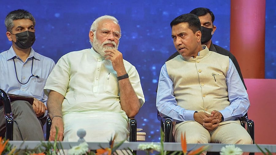 Prime Minister Narendra Modi interacts with Goa CM Pramod Sawant during the latter's swearing-in ceremony, in Panaji. Credit: PTI Photo