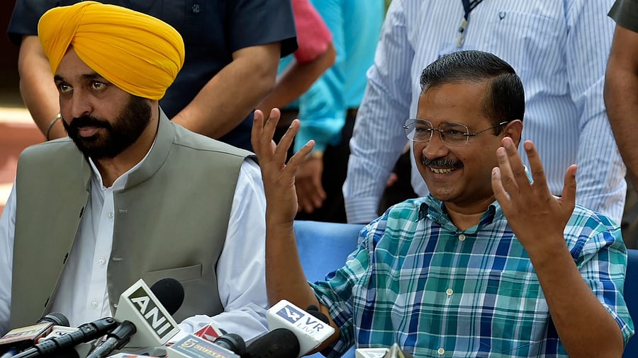 Aam Aadmi Party (AAP) leader and Delhi's chief minister Arvind Kejriwal (R) addresses the media as Punjab's chief minister Bhagwant Mann watches during their visit at the Sabarmati Ashram in Ahmedabad. Credit: AFP Photo