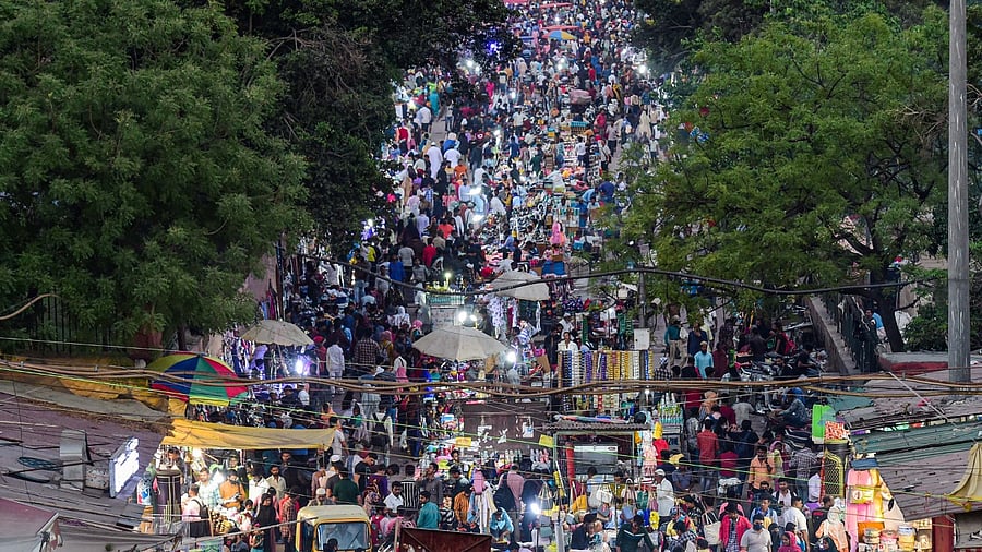 People shop at a market on the eve of holy month of Ramzan, at Jama Masjid area in New Delhi. Credit: PTI Photo