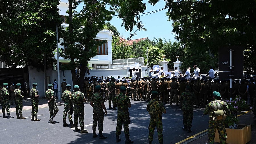 Police Special Task Force (STF) soldiers stand guard as main opposition parliament members protest in Colombo. Credit: AFP Photo