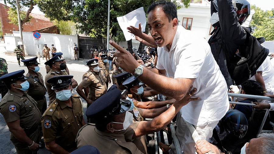 Harshana Rajakaruna, a member of opposition alliance, Samagi Jana Balawegaya, shouts slogans against President Gotabaya Rajapaksa near Independence Square amid curfew. Credit: Reuters Photo