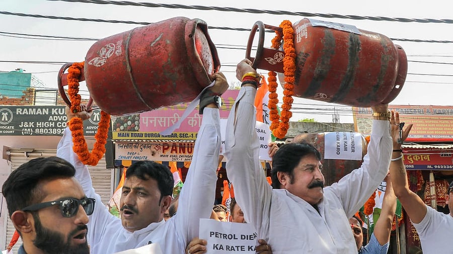 Congress leaders protest over the hike in prices of petrol, diesel and LPG cylinders in Jammu. Credit: PTI