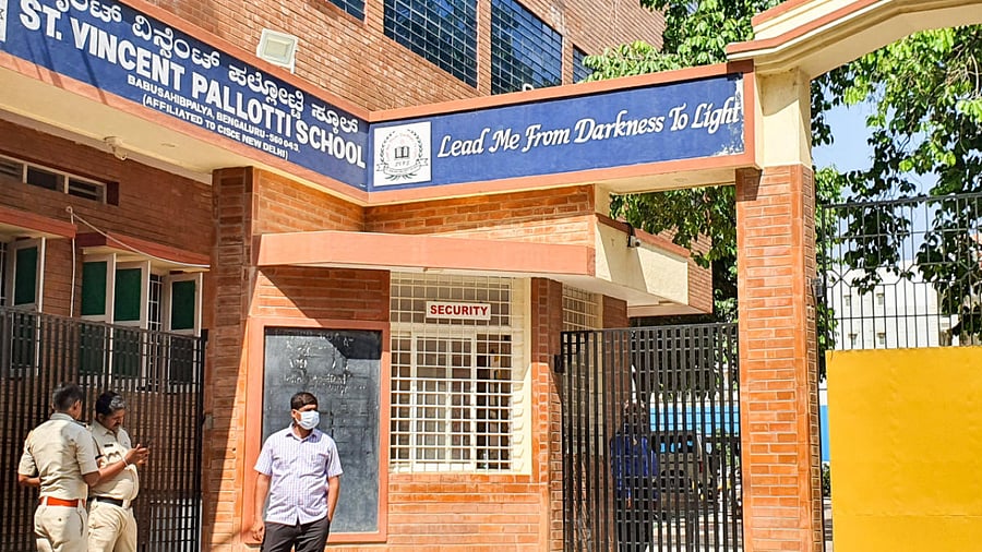 Police personnel stand guard outside St Vincent Pallotti School in Babusapalya. Credit: Special Arrangement