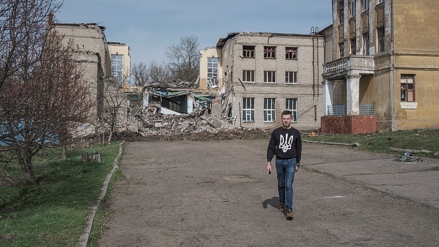 Oleksiy Goncharenko, a member of the Ukrainian parliament, walks in front of a destroyed school, amid Russia's invasion of Ukraine, in Kramatorsk. Credit: Reuters photo